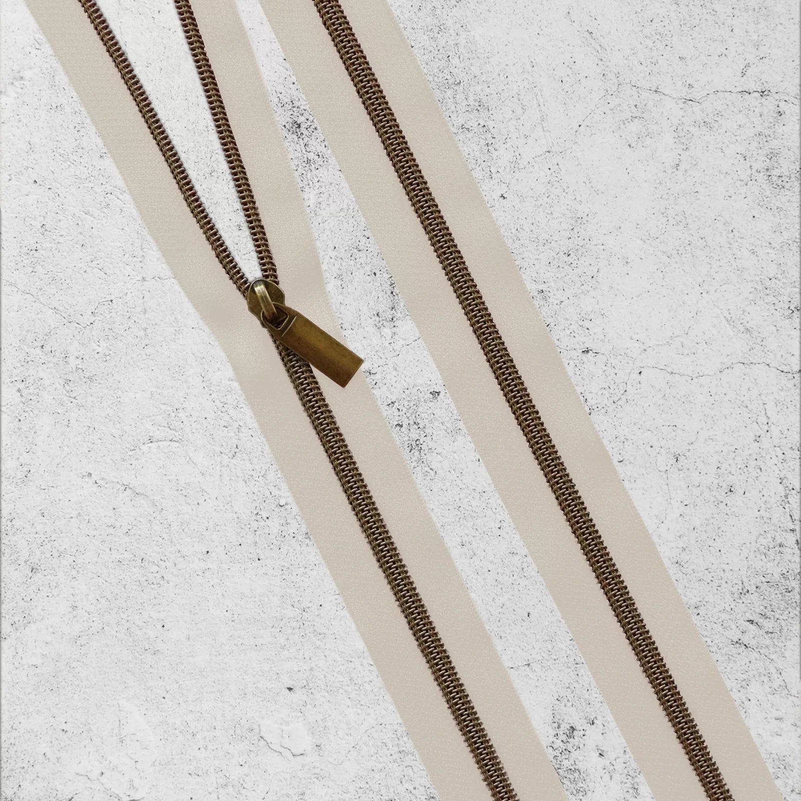 Sallie Tomato - #5 Nylon Zipper By the Yard - Beige/Antique Brass